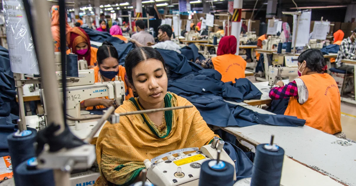 a group of people sewing in a factory