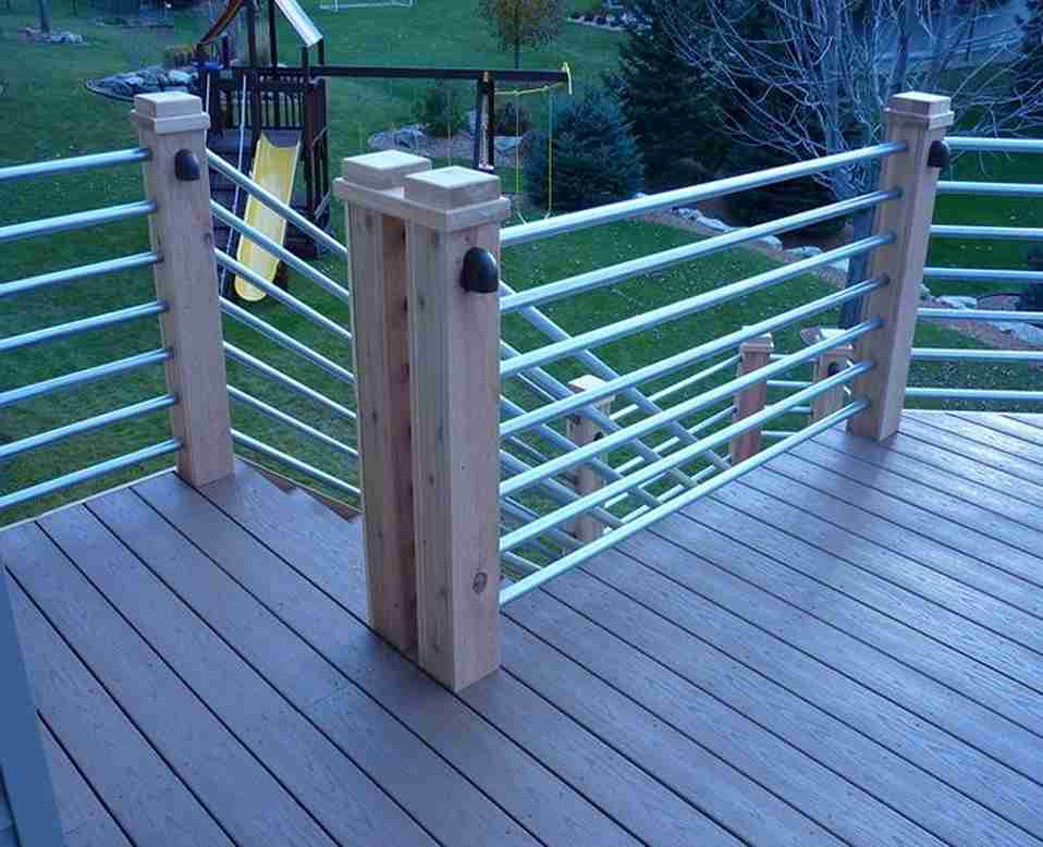a wooden deck with metal railings