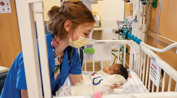 a nurse holding a baby