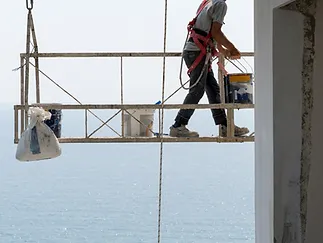 a man walking on a scaffolding