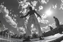 a man standing on a platform with a crowd of people in the background