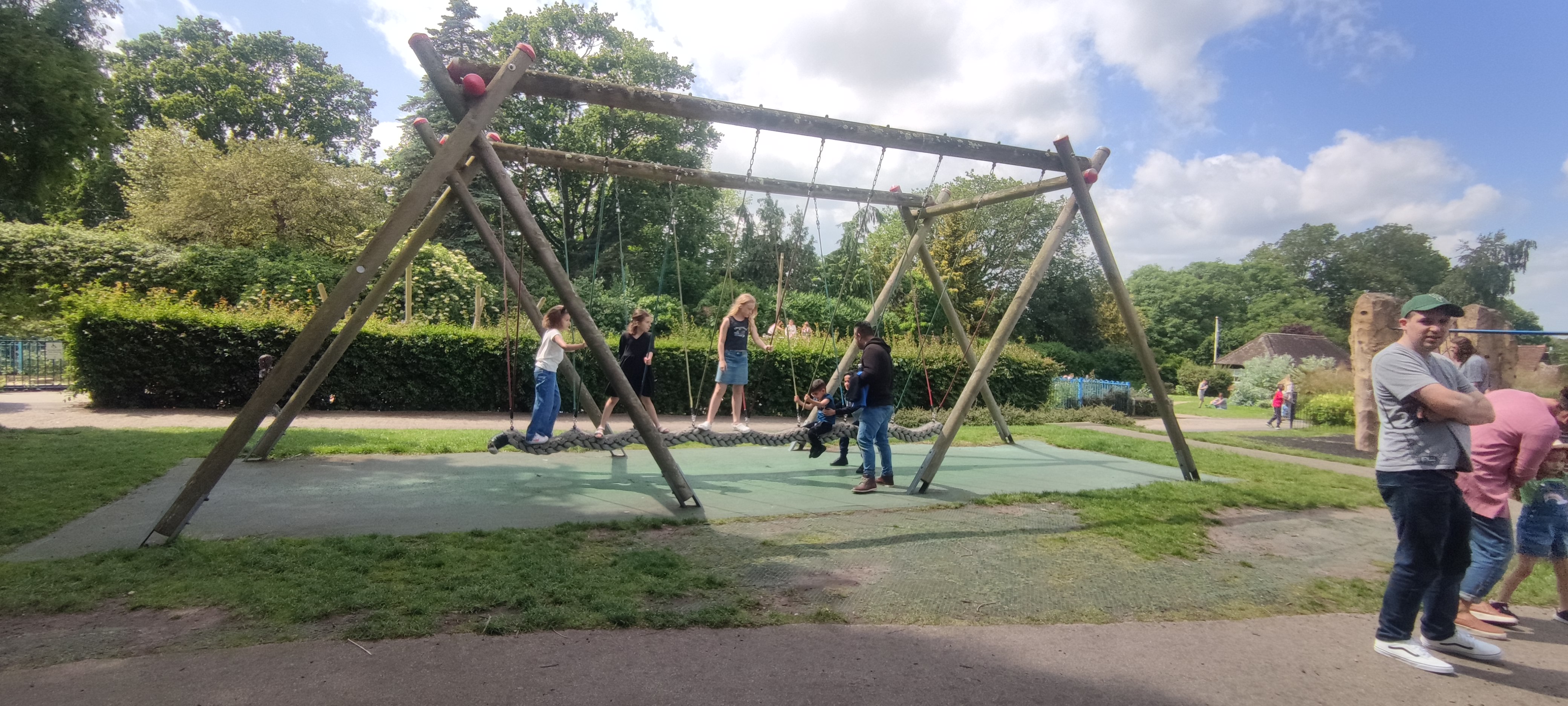 a group of people on a swing set