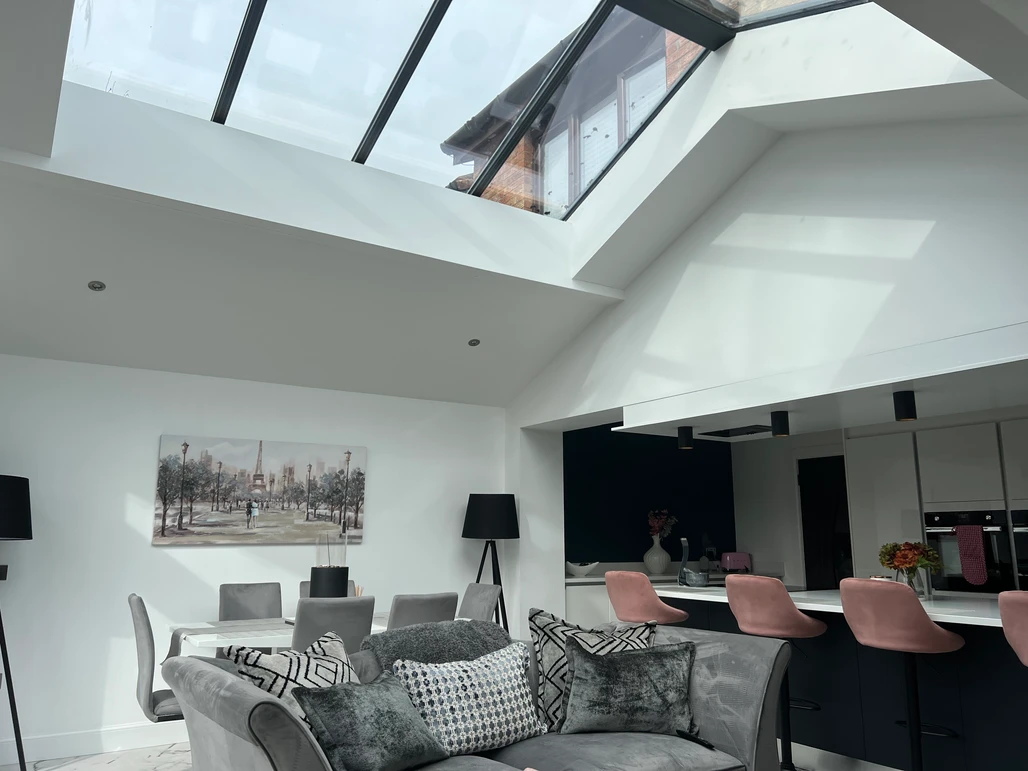 a living room with a skylight