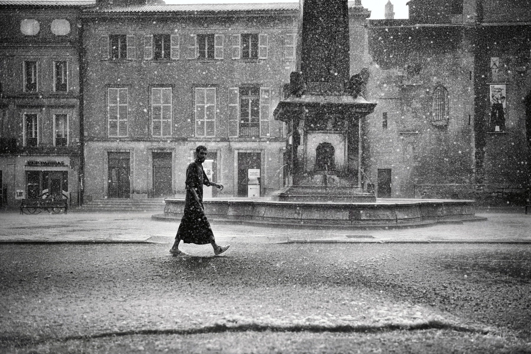 a man walking in the rain