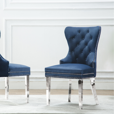 a pair of blue chairs in a room
