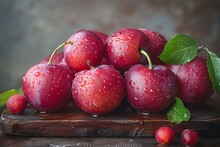 a group of red fruits with leaves