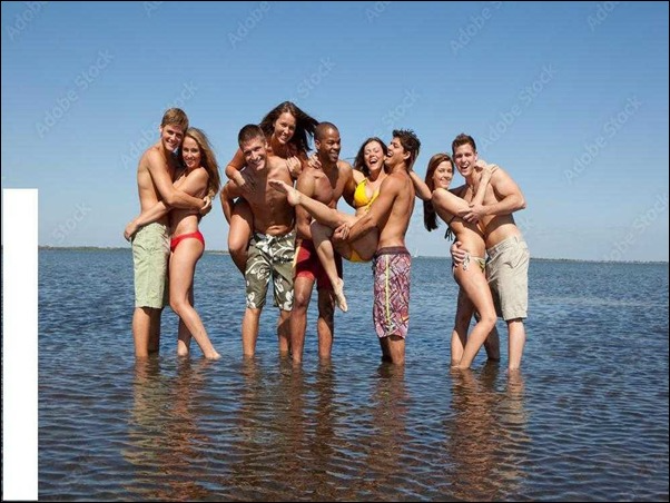 a group of people standing in water
