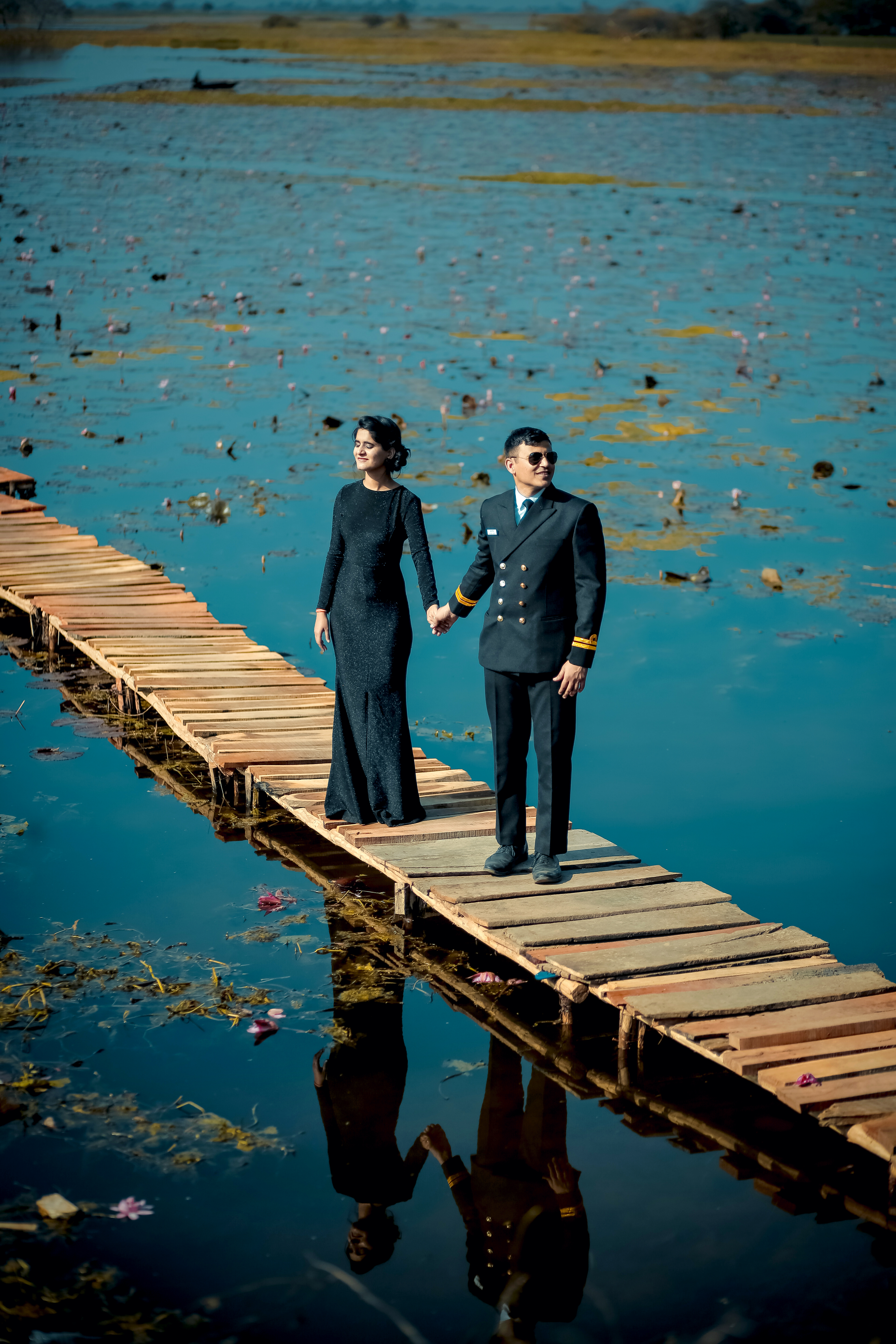 a man and woman standing on a dock