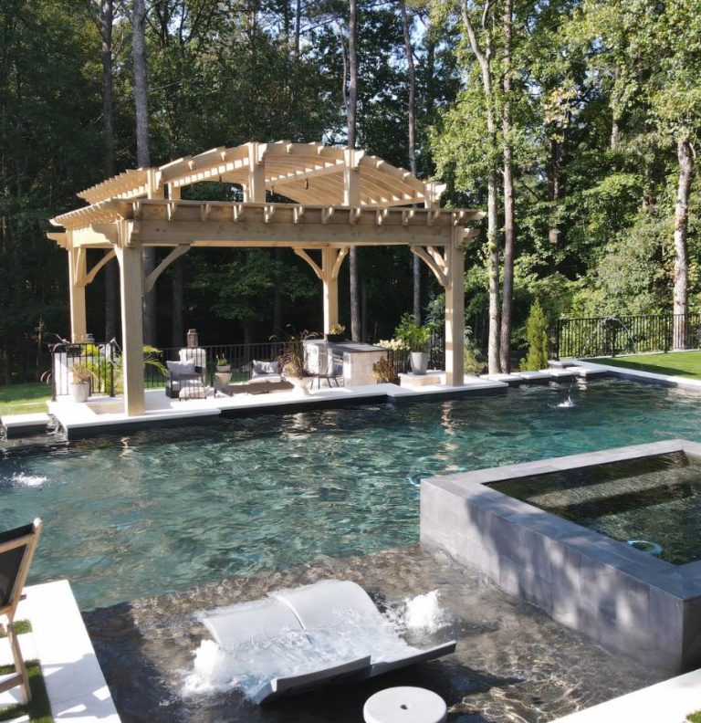 a pool with a hot tub and a wooden structure