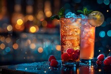 two glasses of drinks with berries