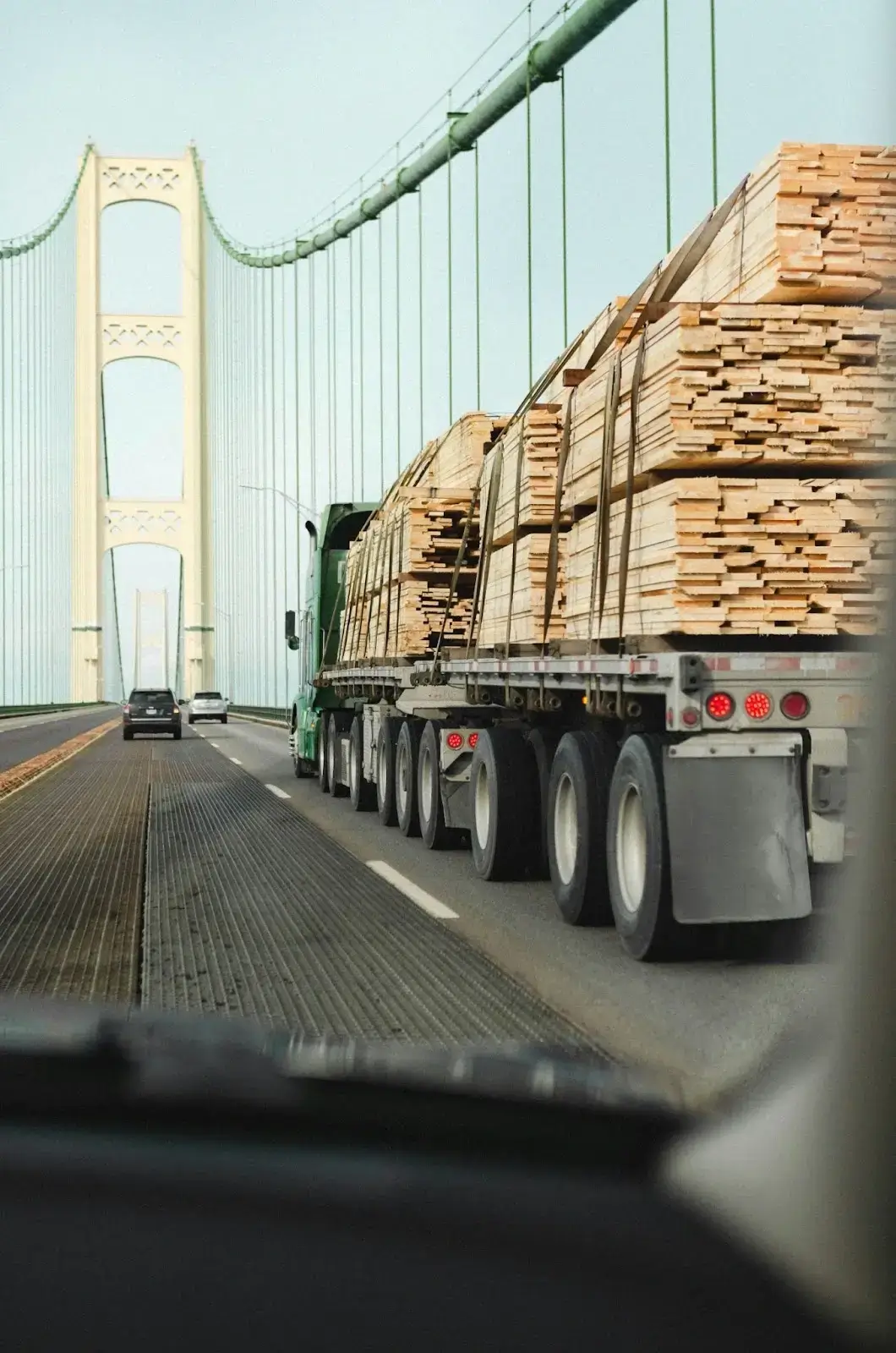 a truck with a load of lumber on the back of it