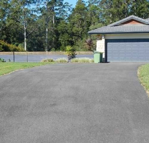 a driveway with a garage