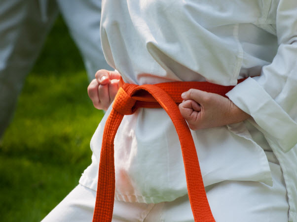 a person wearing a karate belt