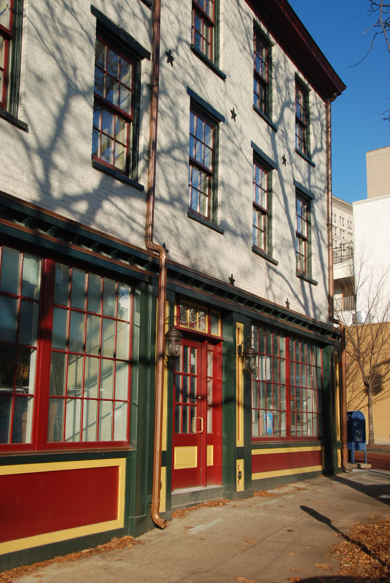 a building with red doors and windows