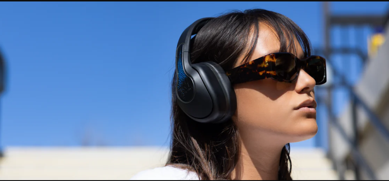 a woman wearing headphones and sunglasses