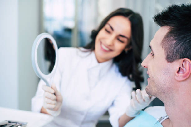 a woman looking at a man's face