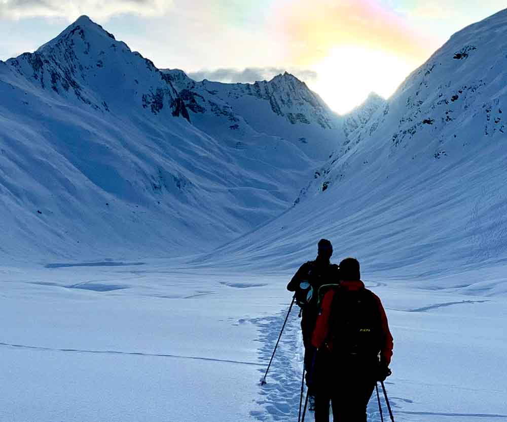 a group of people walking in the snow