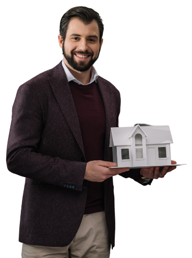 a man holding a small white house