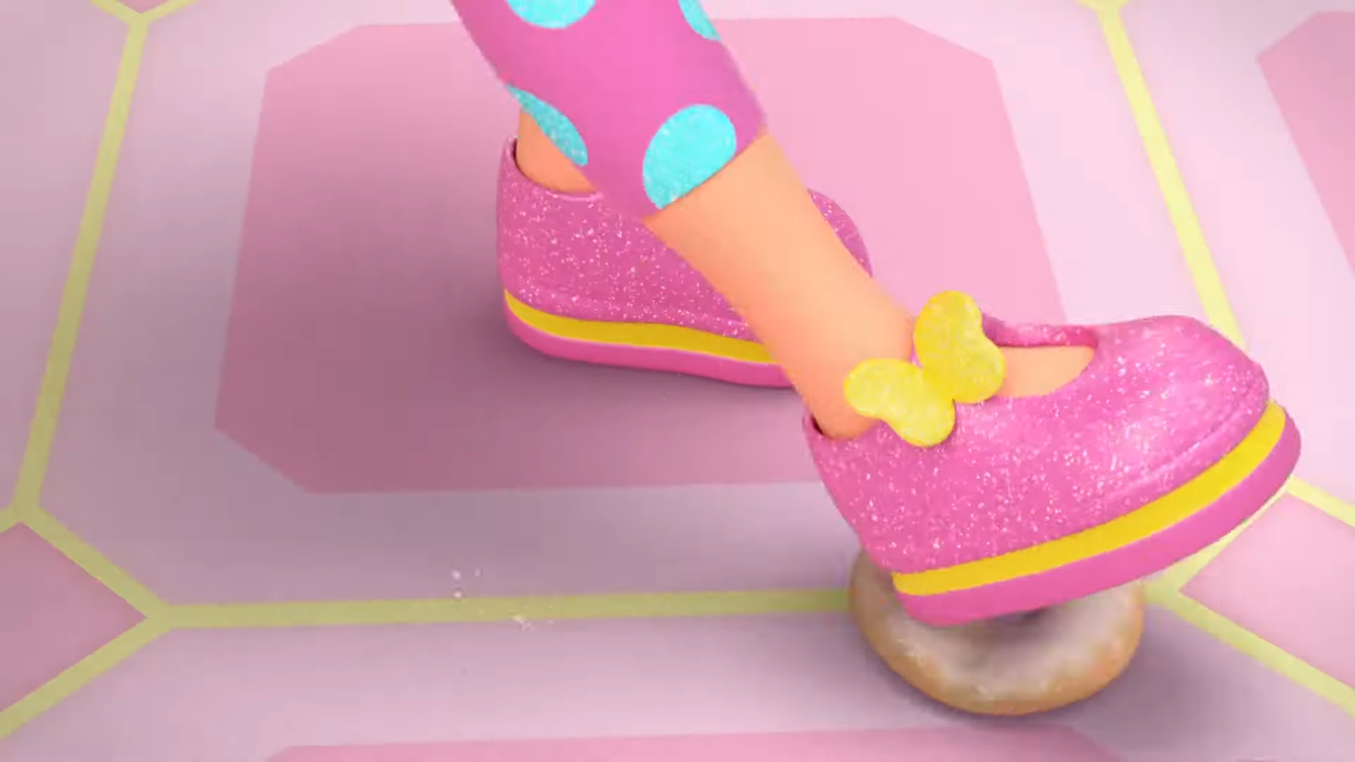 a child's legs wearing pink shoes