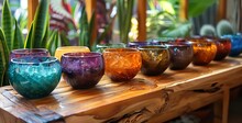 a group of colorful candles on a wood surface