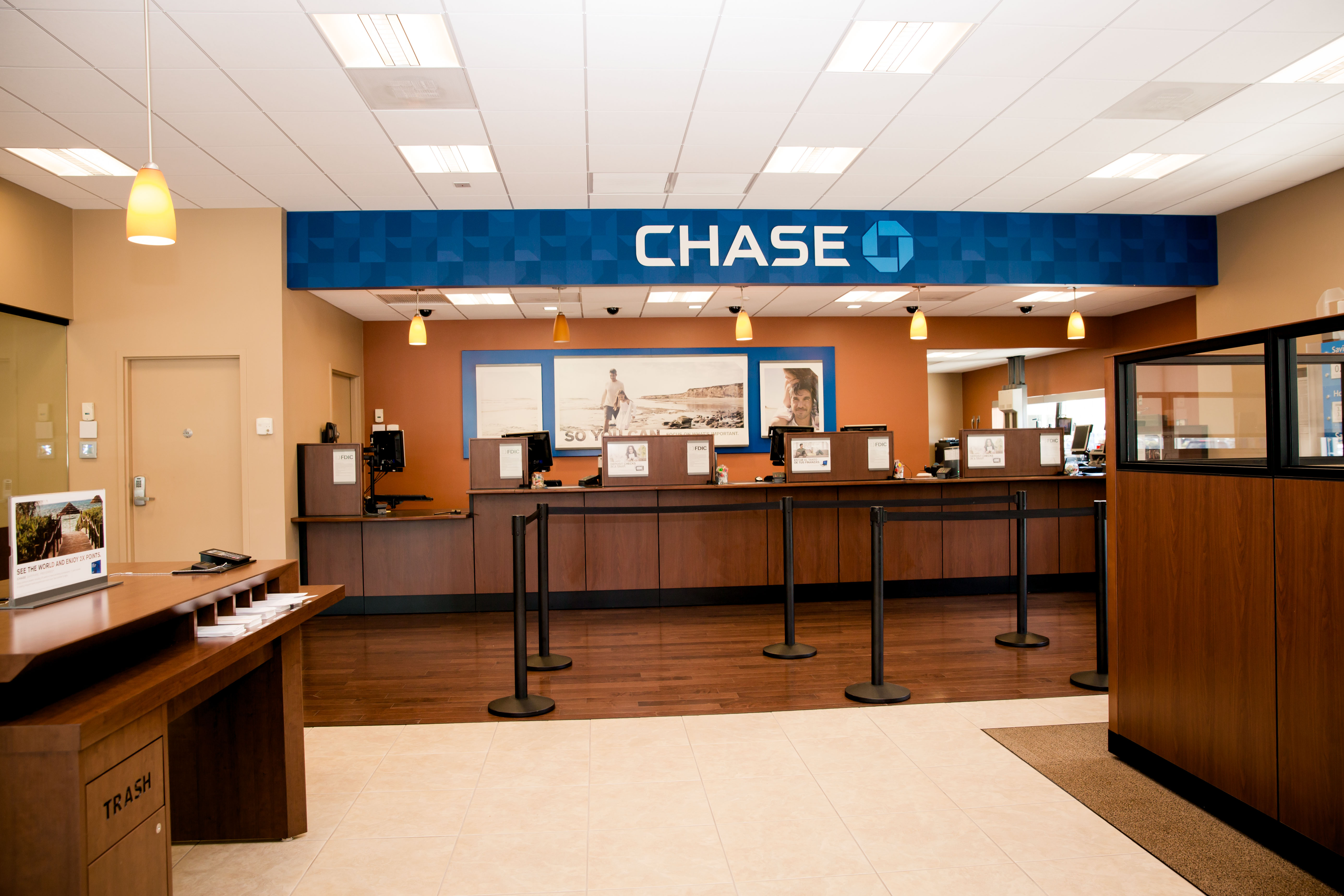 a bank reception area with a sign