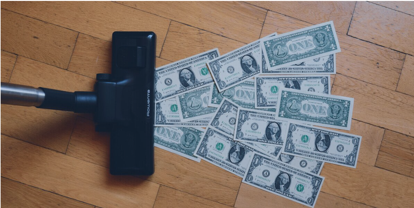 a black device on top of a pile of money
