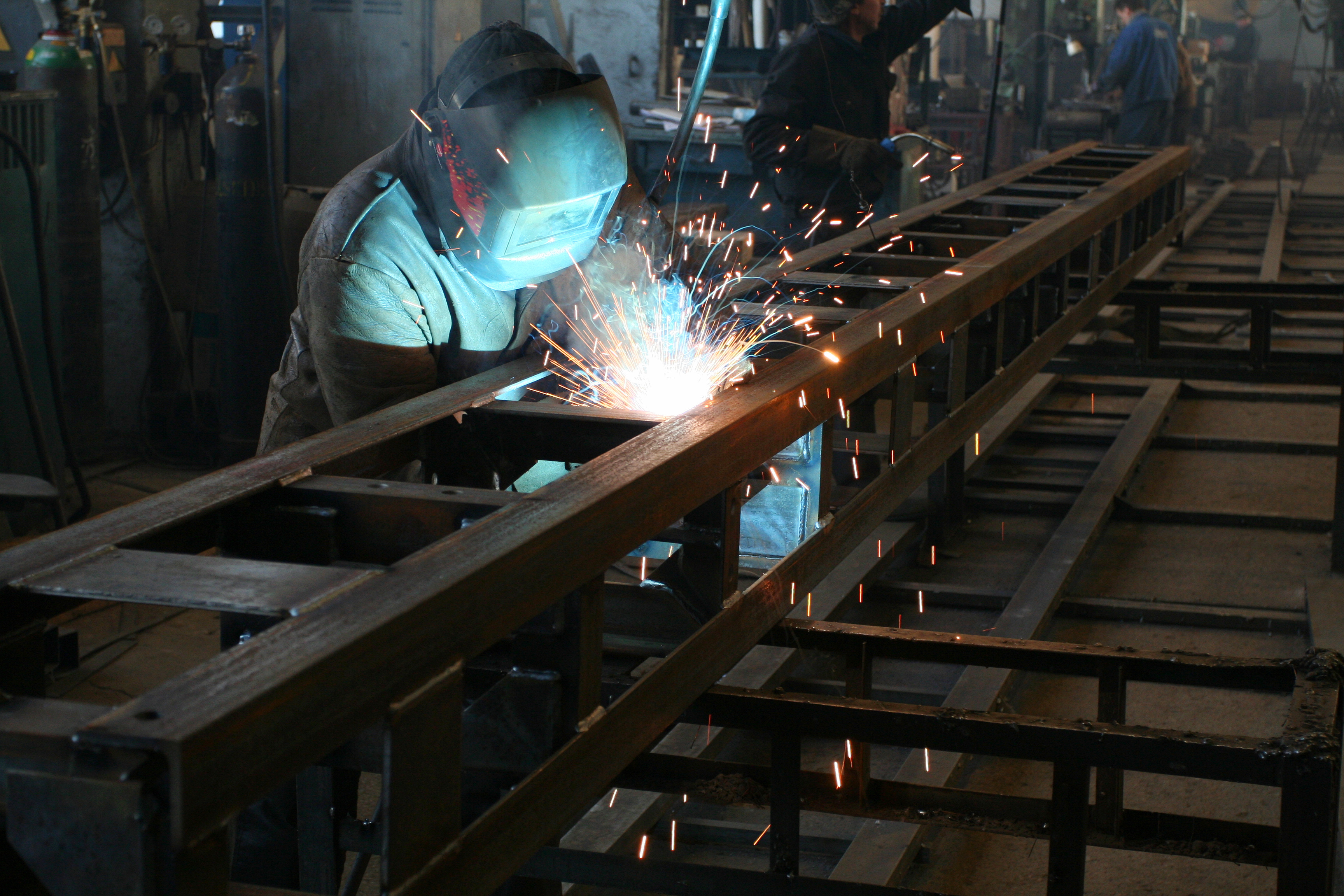 a man welding a metal structure