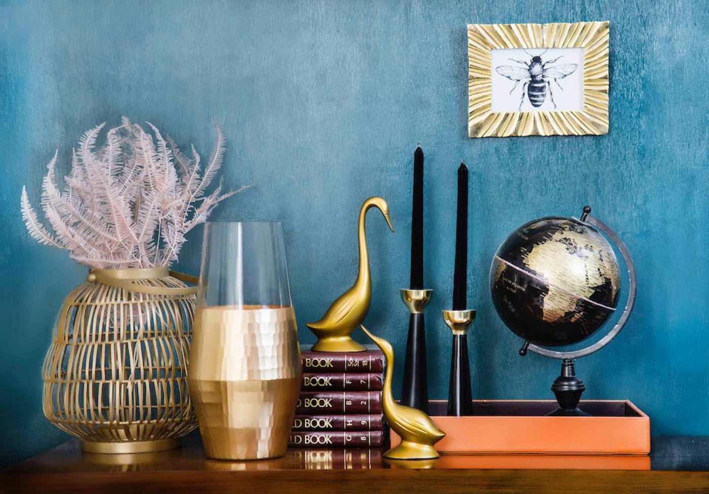 a shelf with books and objects