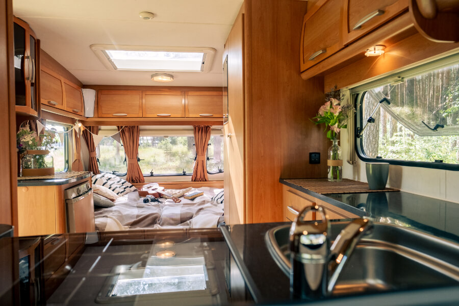 a kitchen with a window and a bed