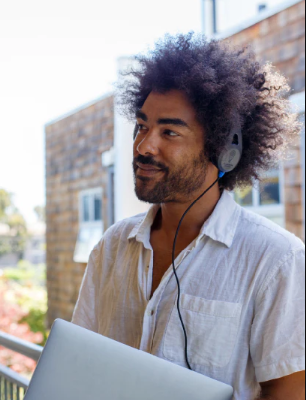 a man with afro hair wearing headphones