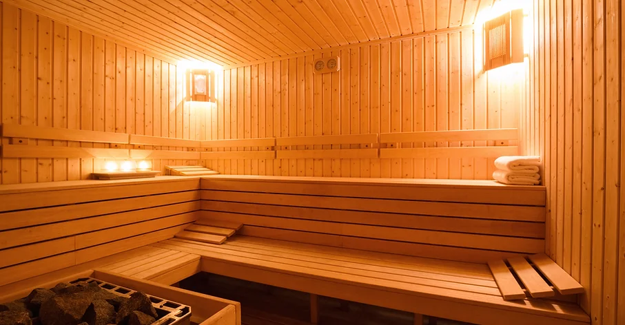a wooden sauna with a wooden bench