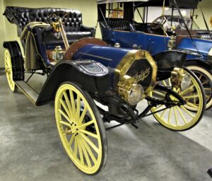 a blue and yellow antique car