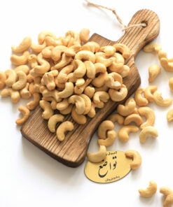 a pile of cashew nuts on a cutting board