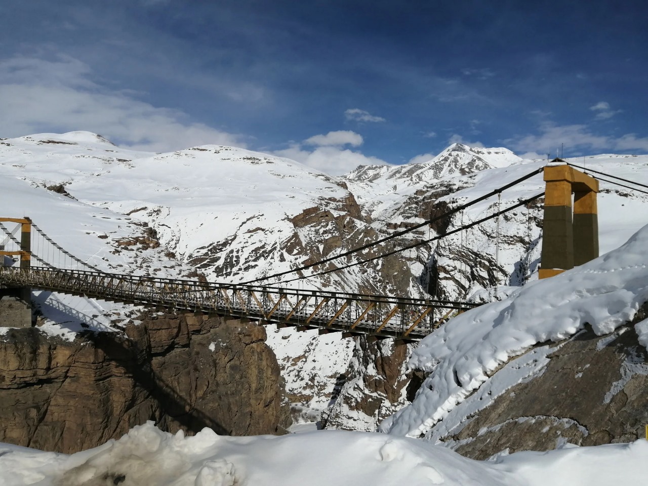 a suspension bridge over a rocky canyon