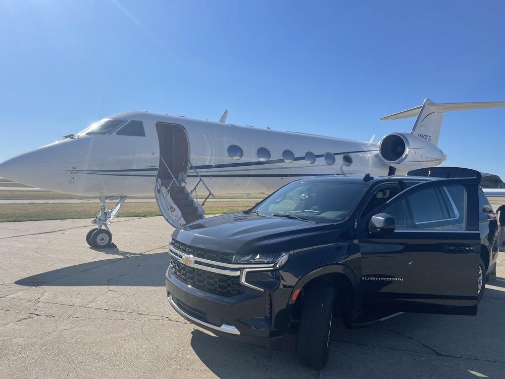 a car parked next to a plane
