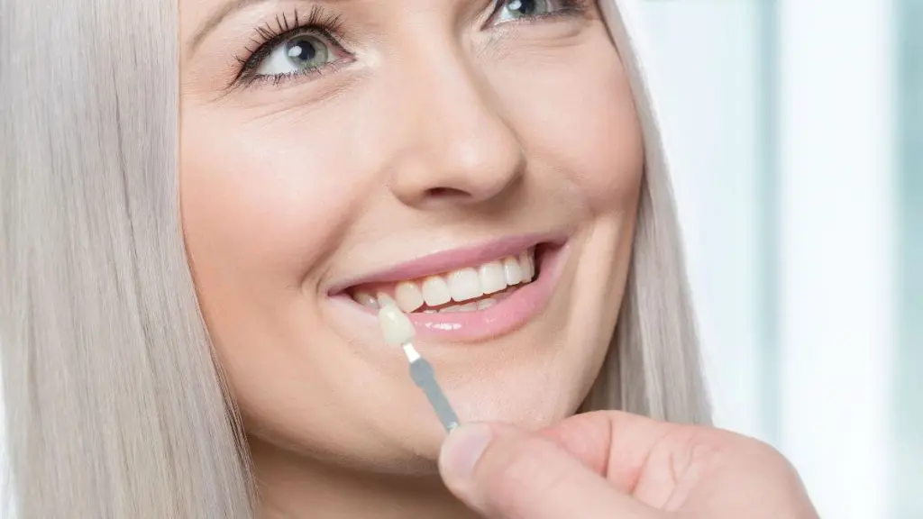 a woman smiling with a toothpick
