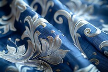 a blue and white fabric with swirls