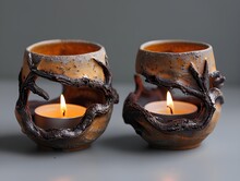 two candles in a candle holder