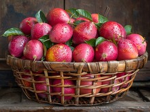 a basket of apples with leaves