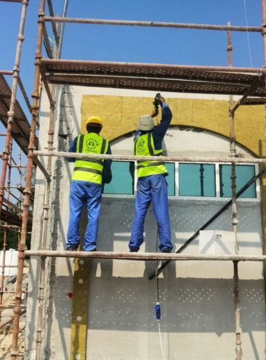 a group of men working on a scaffolding