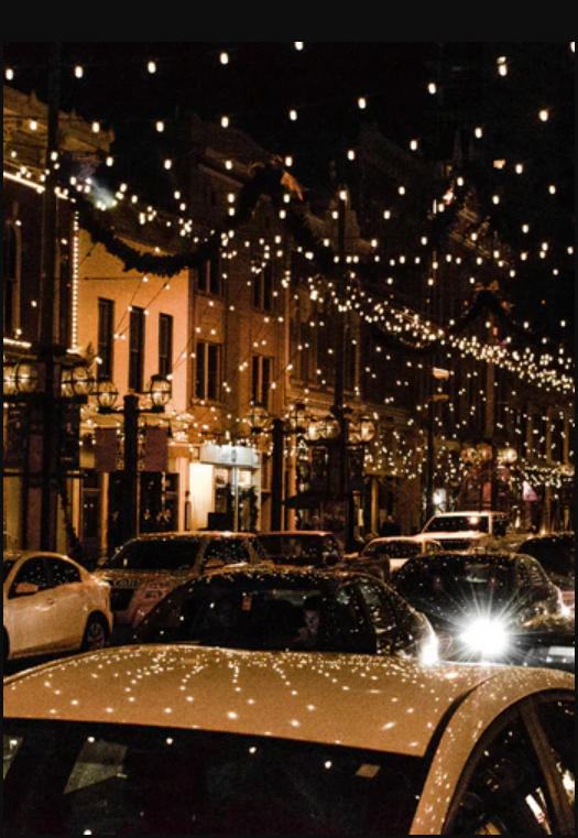 a car on a street with lights