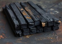 a stack of black wood