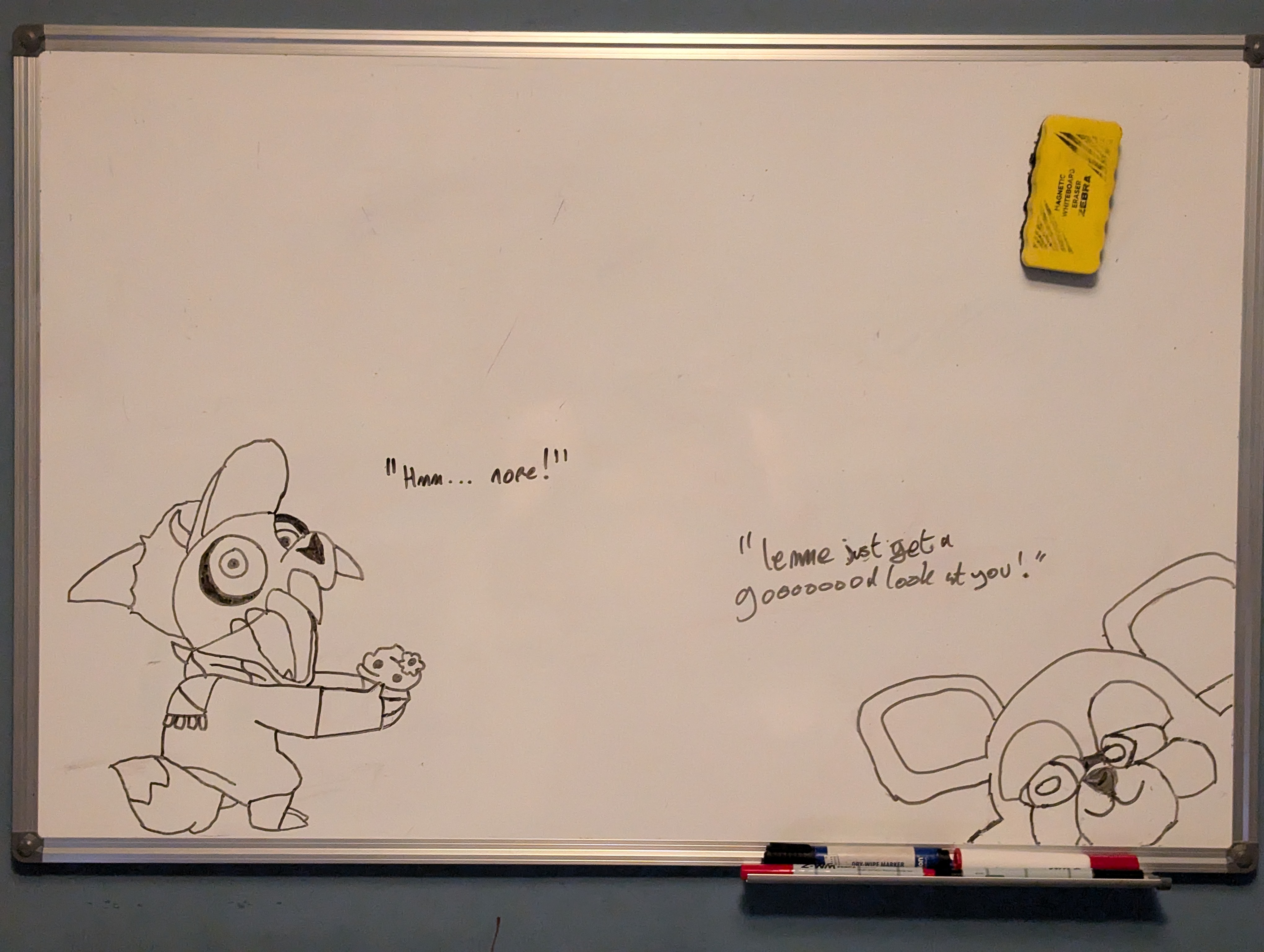 a whiteboard with a drawing of a cartoon character and a marker