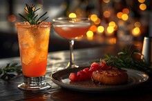 a plate of food and a drink on a table