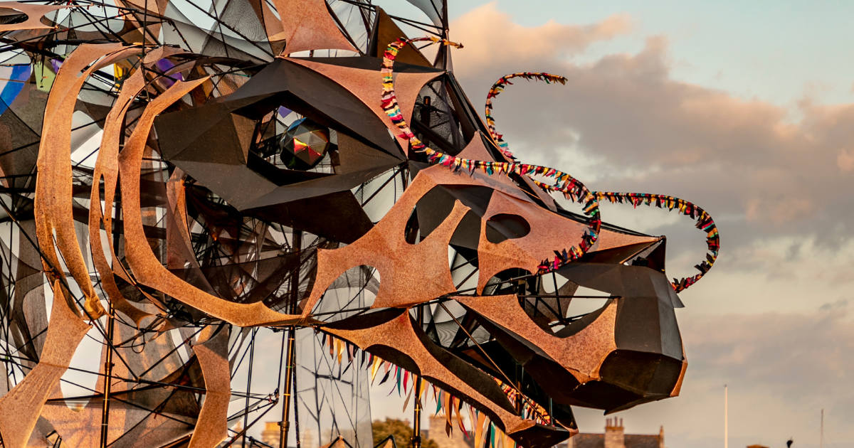 a sculpture with colorful ribbons