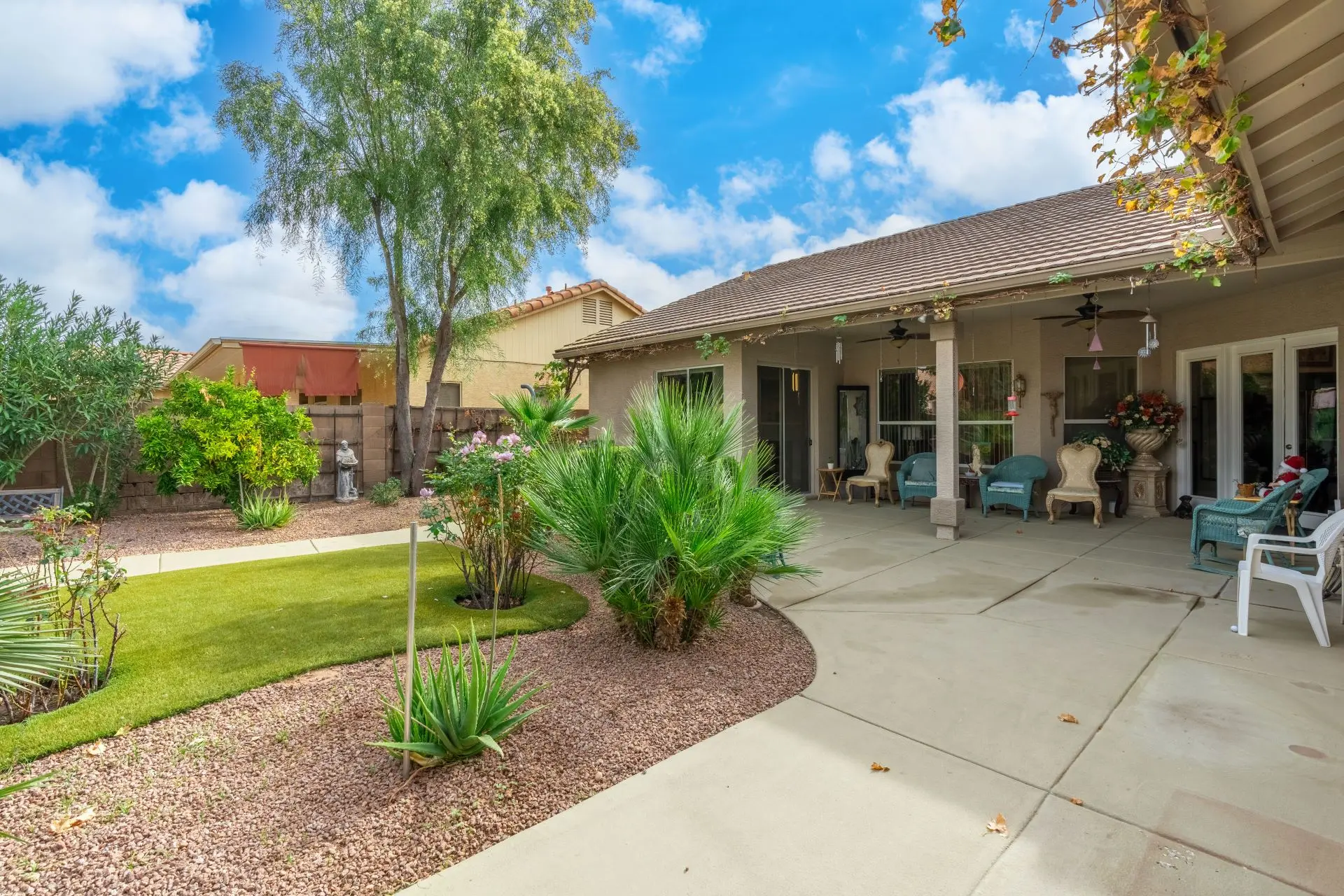 a house with a patio and lawn