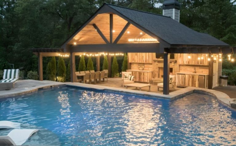 a pool with a covered patio and a covered deck