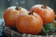 a group of orange fruit in a basket