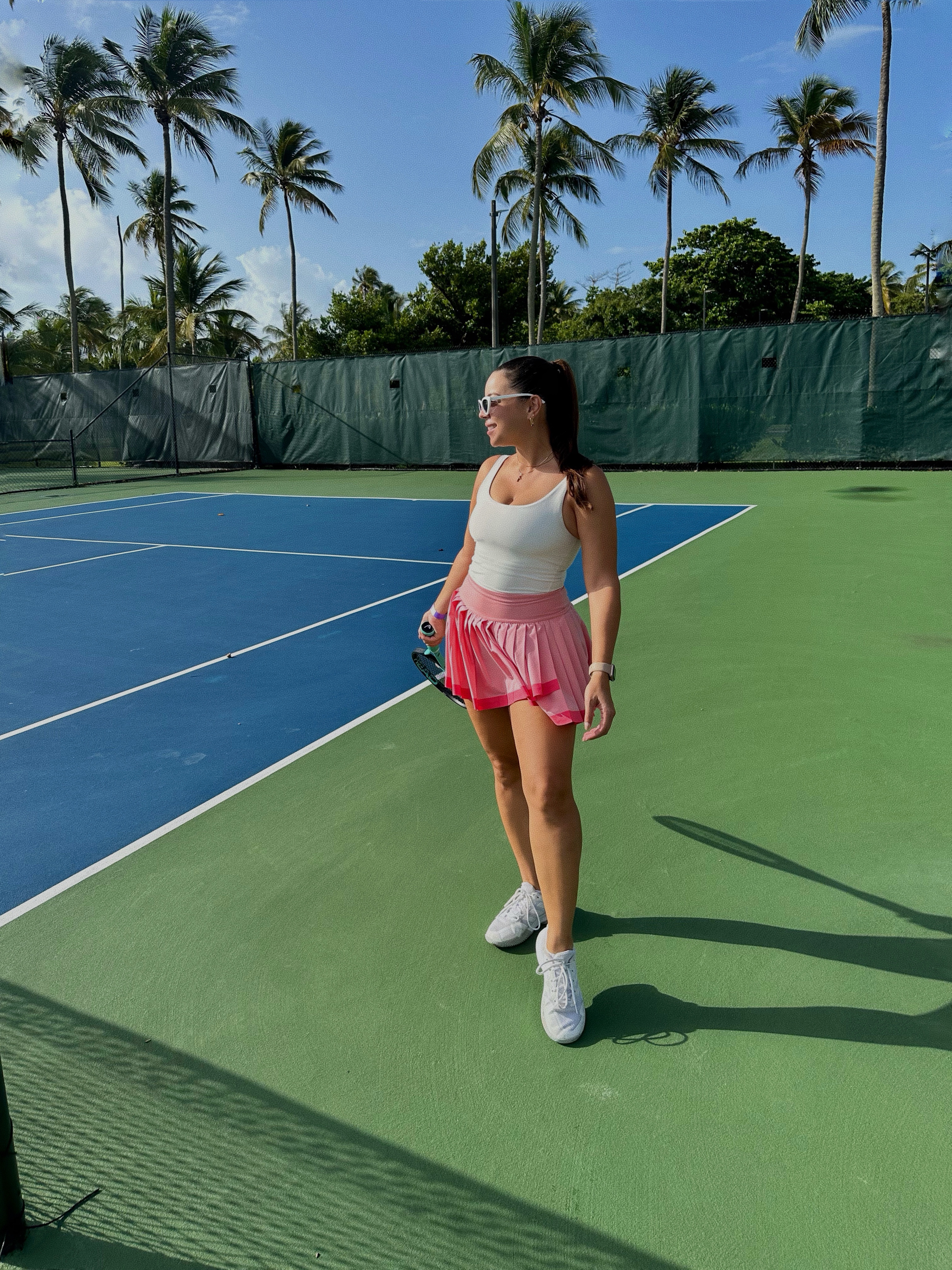 a woman standing on a tennis court