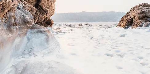 a rocky cliff in the snow